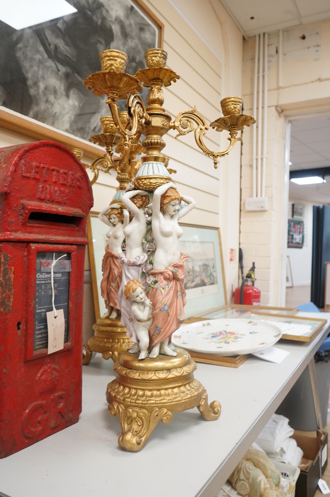 A pair of mid 20th century Italian porcelain and gilt metal mounted figural candelabra- 69cm high